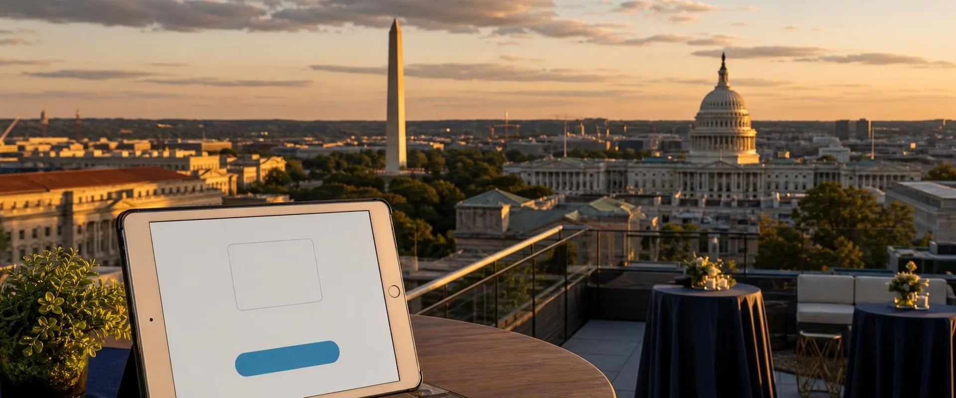 Silver iPad tablet on a Washington, D.C. rooftop terrace with the Washington Monument and U.S. Capitol